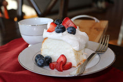 Mom's Place angel food cake batter being whipped with egg whites, easy-to-follow steps.