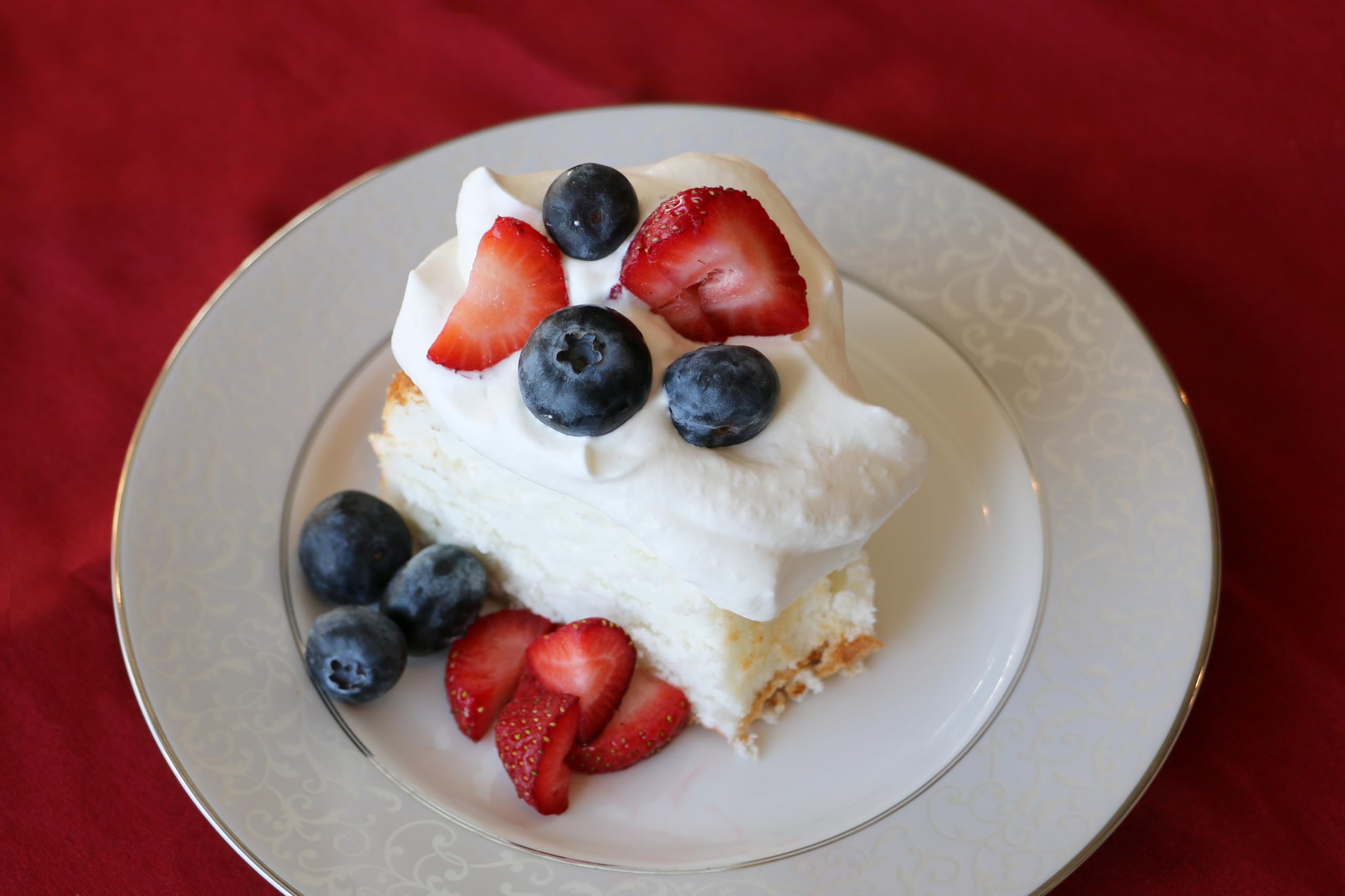 Mom's Place gluten-free angel food cake mix label close-up, free from gluten and dairy.