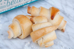 Dough-rolling scene with Mom's Place Crescent Roll Mix in use