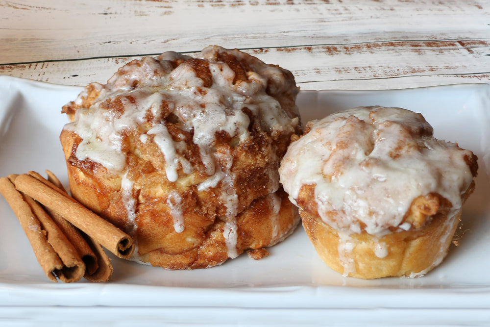 Mom's Place Gluten-Free cinnamon bun duo served at a family table.