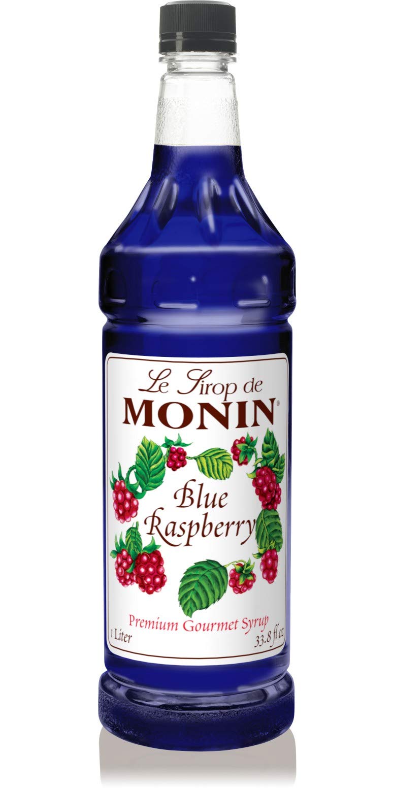 Monin Blue Raspberry Syrup bottle pour for vibrant lemonades and cocktails.