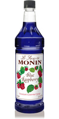 Monin Blue Raspberry Syrup bottle pour for vibrant lemonades and cocktails.