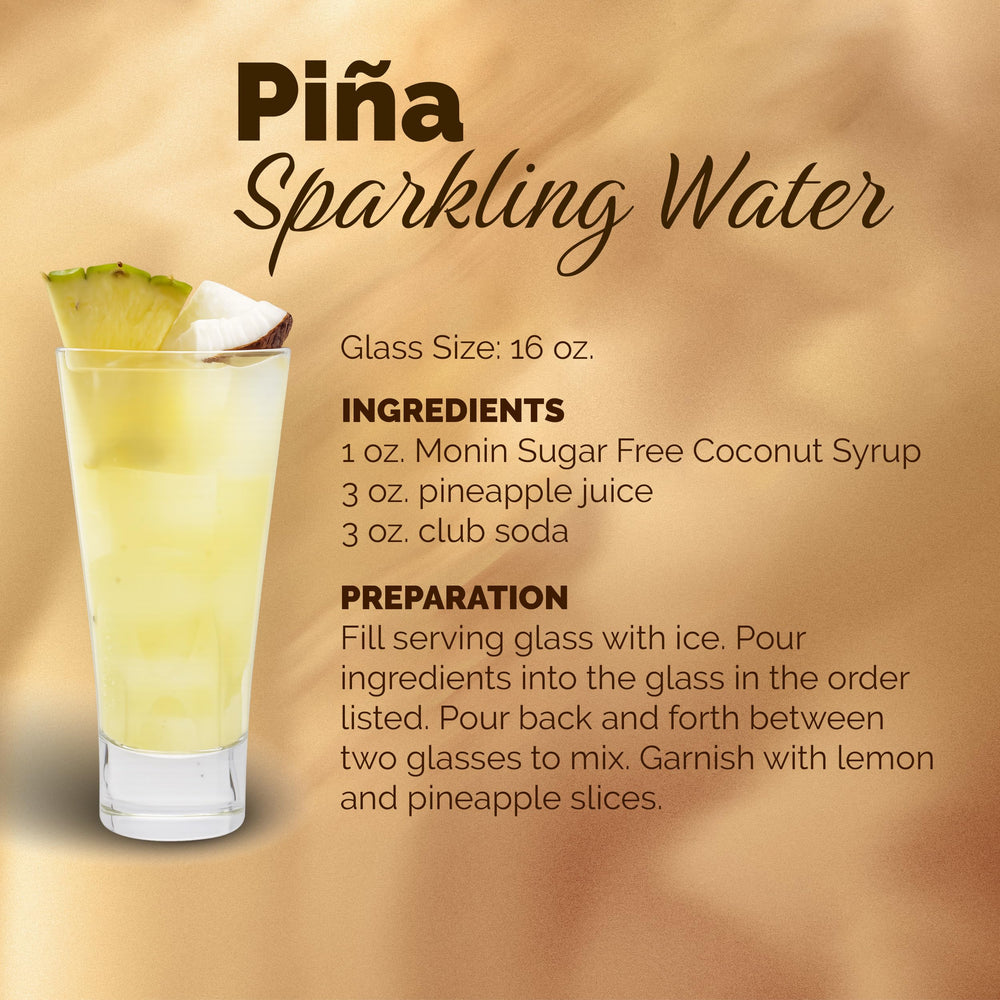 Monin Coconut Syrup bottle on ice with lime garnish.