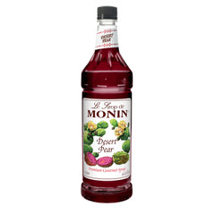 Monin Desert Pear Syrup bottle elevates drinks with a bold fuchsia hue.