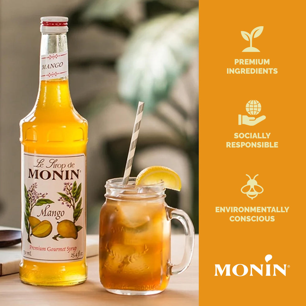 Monin Mango Syrup over a dessert plate suggesting dessert and frozen drink uses
