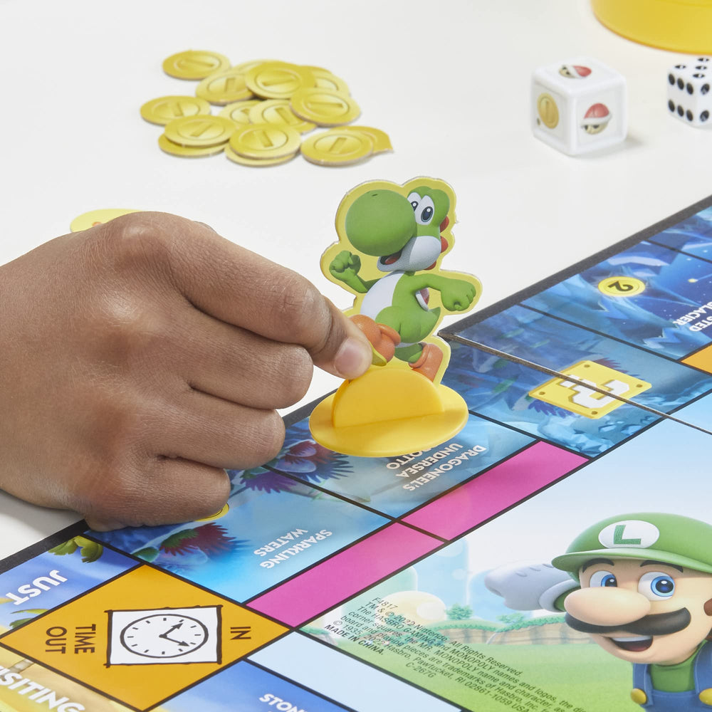 Monopoly Junior Super Mario Edition Yoshi's Hill board space evokes familiar Mushroom Kingdom scenes.