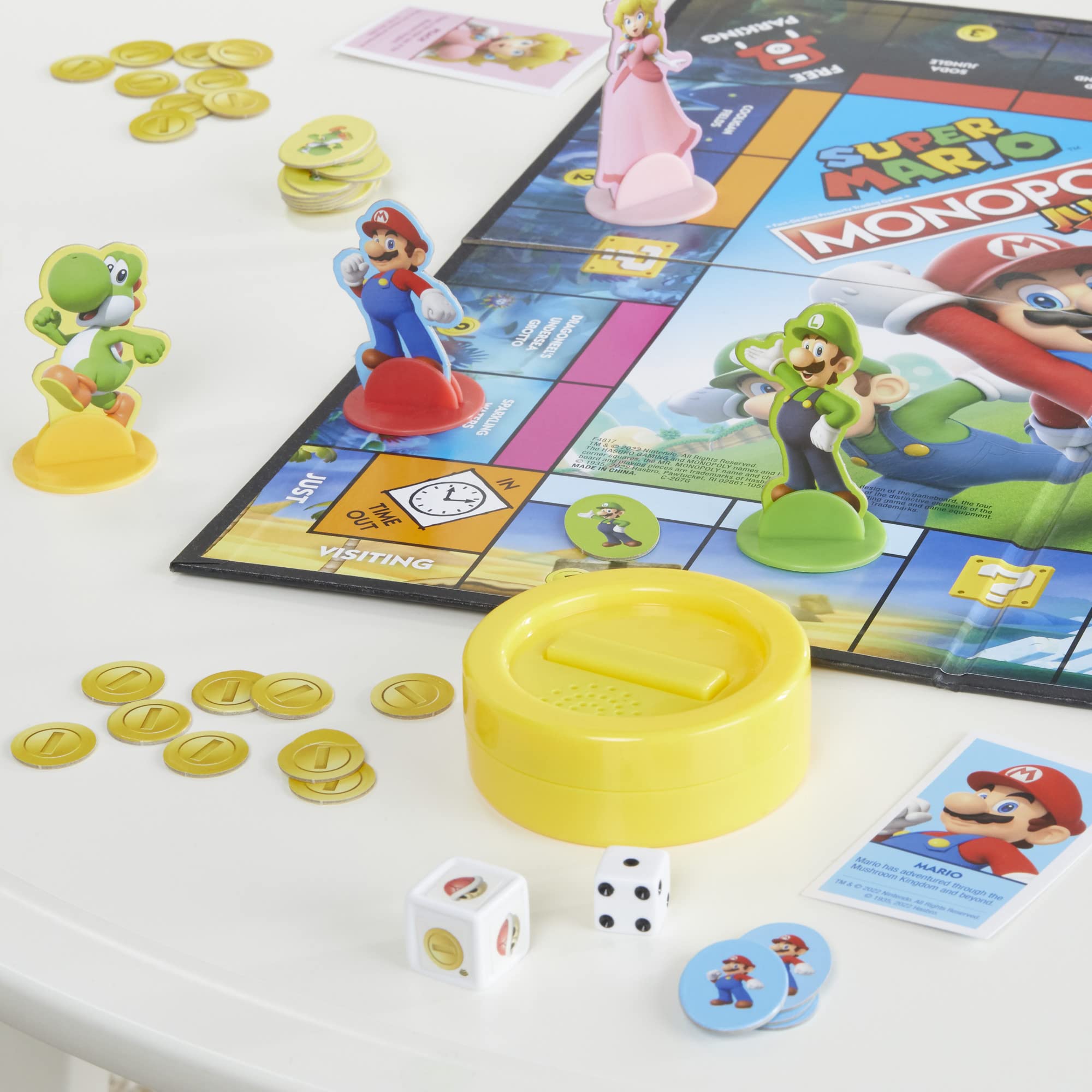 Monopoly Junior Super Mario Edition Yoshi character piece ready for play.