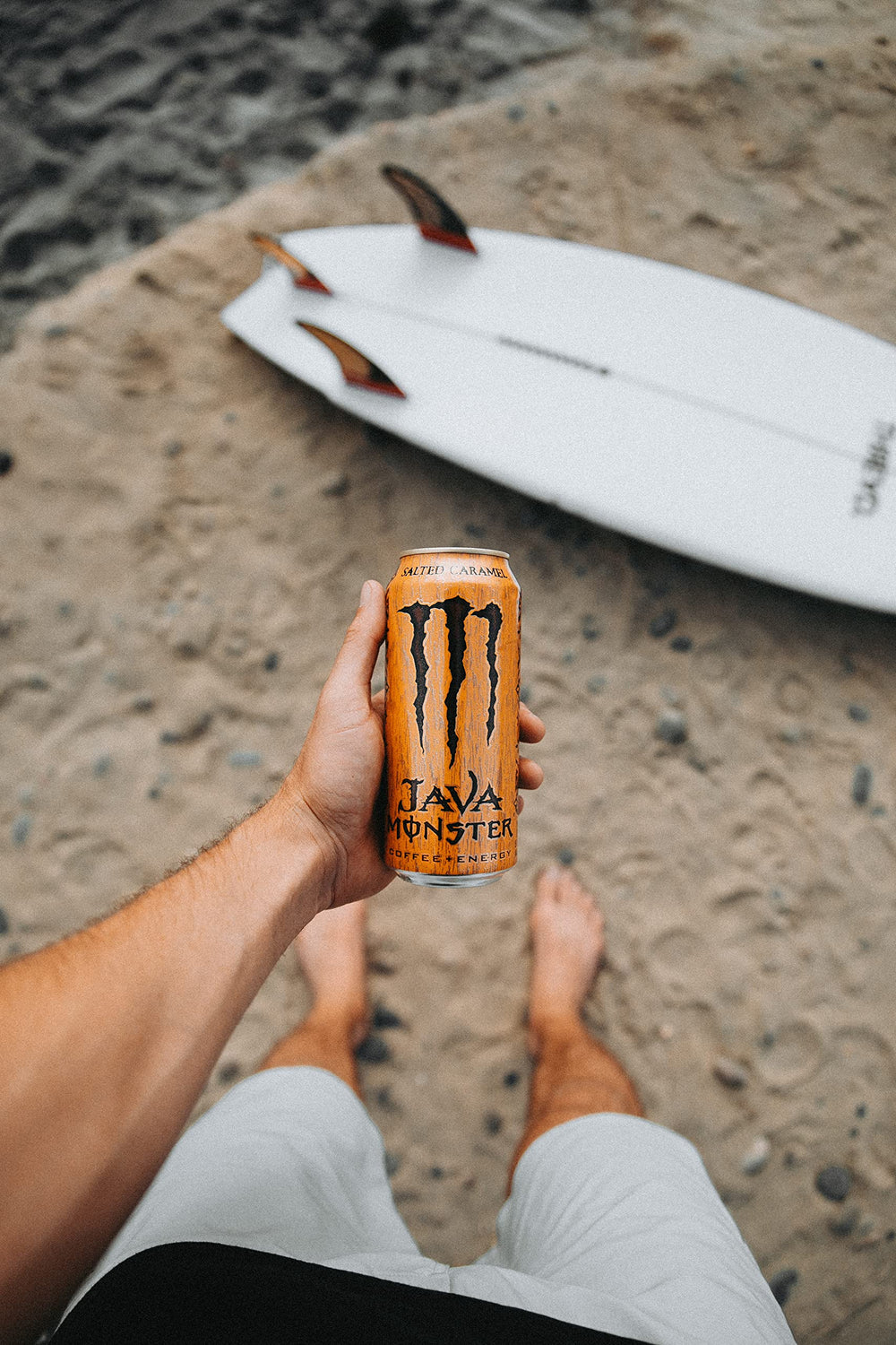 Side view of rich salted caramel cream and Monster branding.