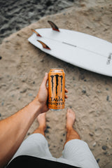 Side view of rich salted caramel cream and Monster branding.