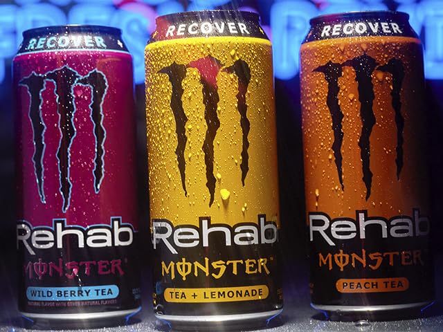 Monster Rehab can on desk in the image, ready-to-go energy and hydration option.