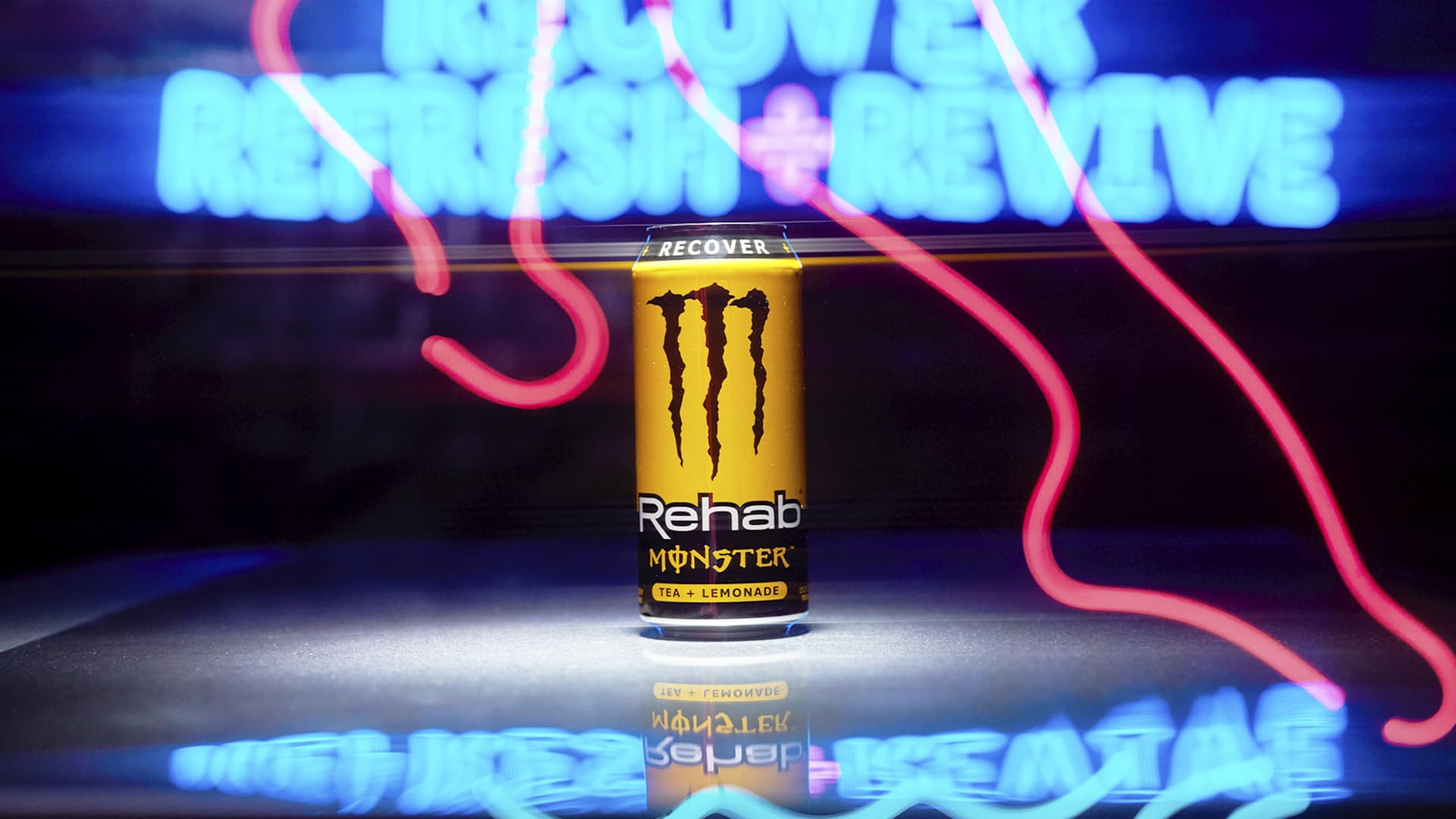 Monster Rehab Tea Lemonade with lemon slices twist.