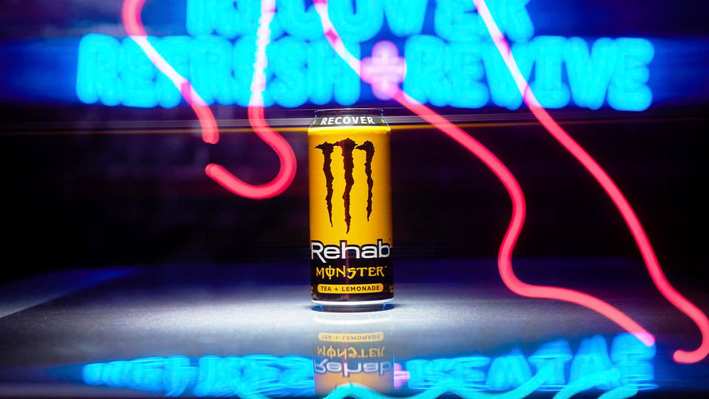 Monster Rehab Tea Lemonade with lemon slices twist.