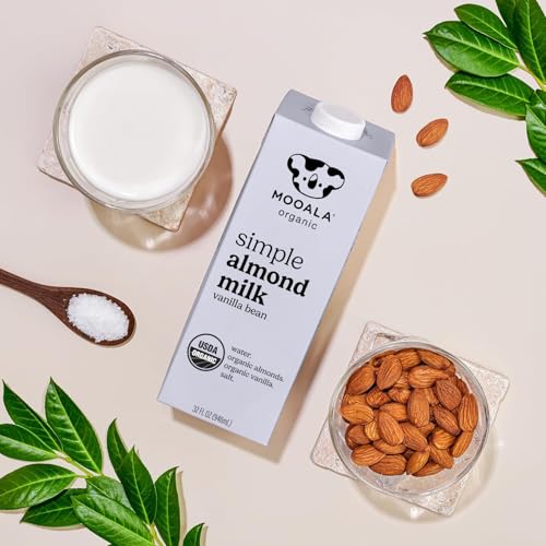Glass with Mooala Almond Milk and cereal for a plant-based breakfast.