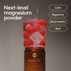 Scoop of Magnesi-Om powder ready to mix in water.