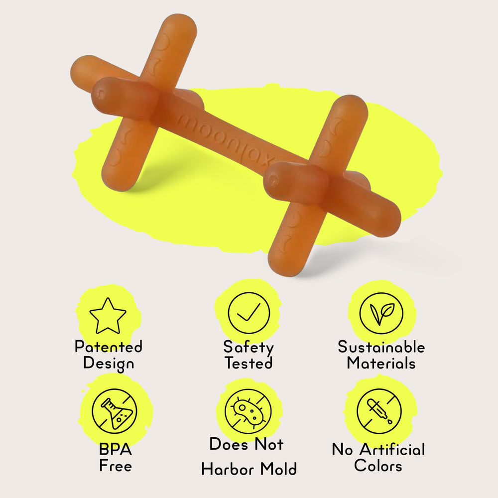 Moonjax teether in a clean setting demonstrates dishwasher-safe care.