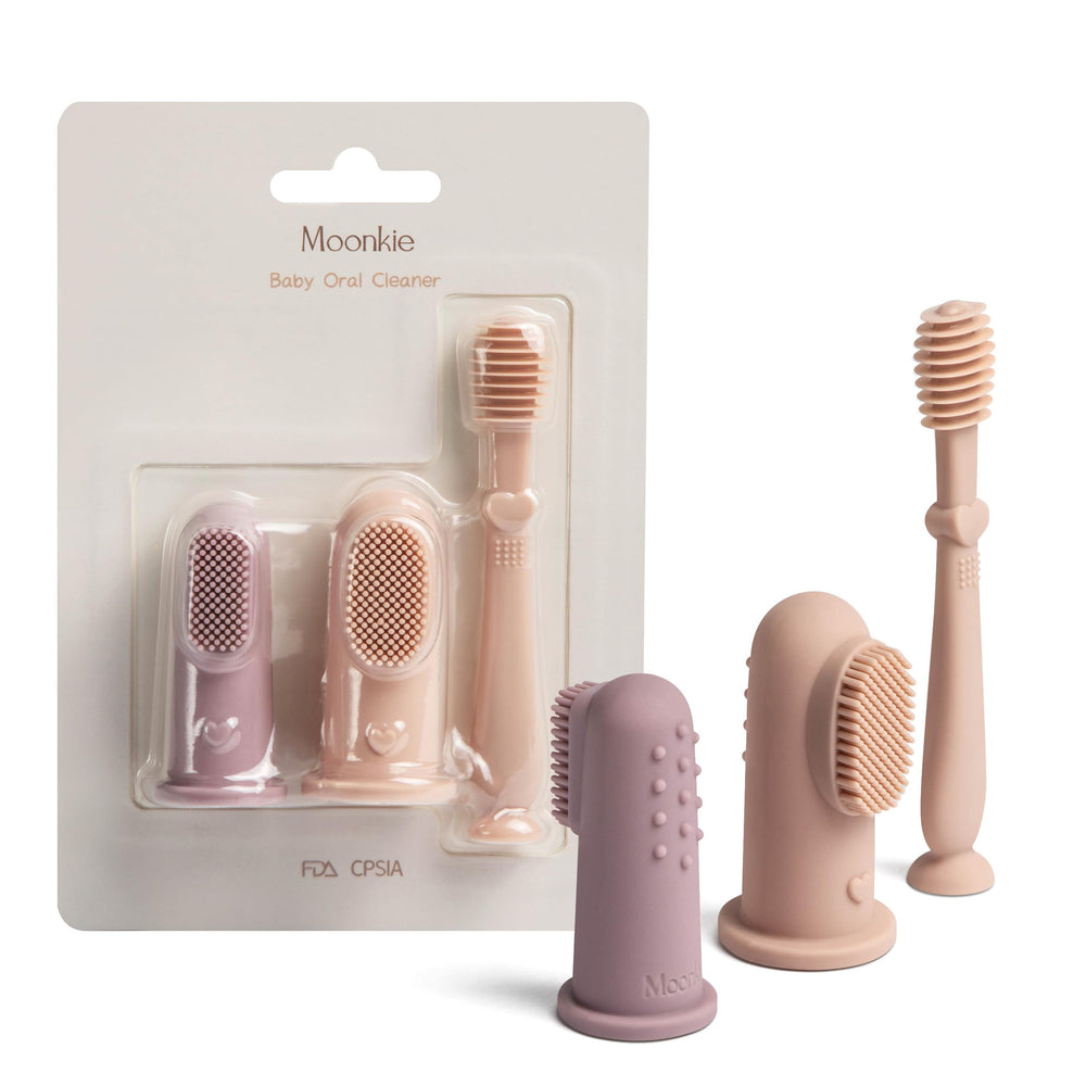 Moonkie finger toothbrush with soft silicone bristles for gentle gum care.