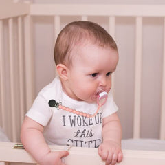 MORIBOX Paci Clip in use with baby for hands-free soothing.