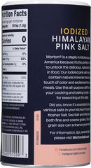Morton iodized Himalayan pink salt shaker on counter for quick seasoning.