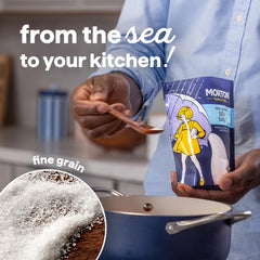 Morton Fine Sea Salt being poured into a pan for cooking.