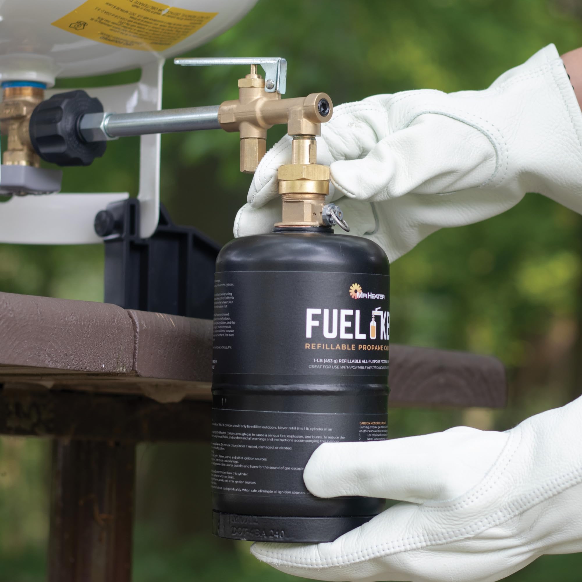 Mr. Heater Fuel Keg 1lb tank connected to grill demonstrates portable propane.