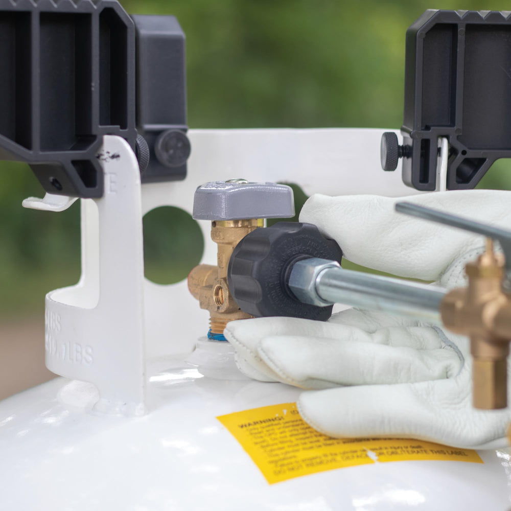 Portable Fuel Keg refill kit beside 1lb tank for trips.