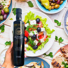 Pouring Mr. Papou's olive oil for a smooth salad drizzle.