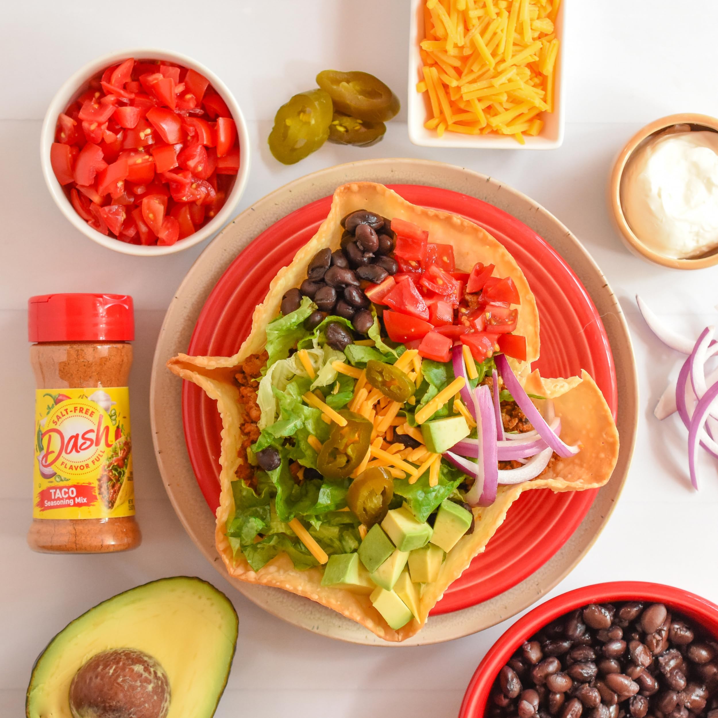 Mrs. Dash salt-free seasoning sprinkles into ground turkey for savory meals.
