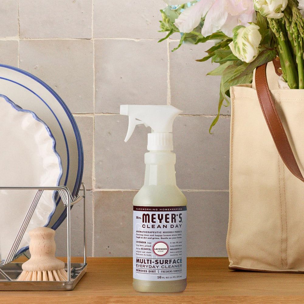 Bathroom fixtures with lavender cleaner bottle ready for a quick wipe-down.