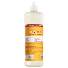Clementine dish soap poured for quick hand washing from Mrs. Meyer's bottle.