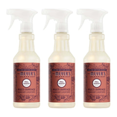 Mrs. Meyer's Clean Day Fall Leaves bottle spritzing kitchen surfaces with a fresh scent.