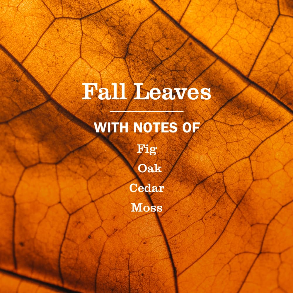 Close-up of Fall Leaves bottle on glass and metal surfaces.
