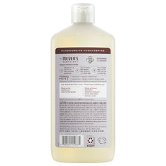 Pouring Mrs. Meyer's Clean Day Lavender detergent to show easy dosing for 60 loads