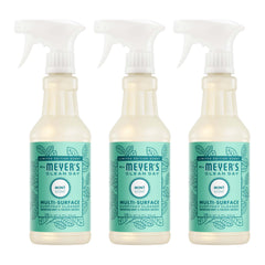 Mrs. Meyer's Clean Day Mint bottle pouring for quick spray-and-wipe cleanup.