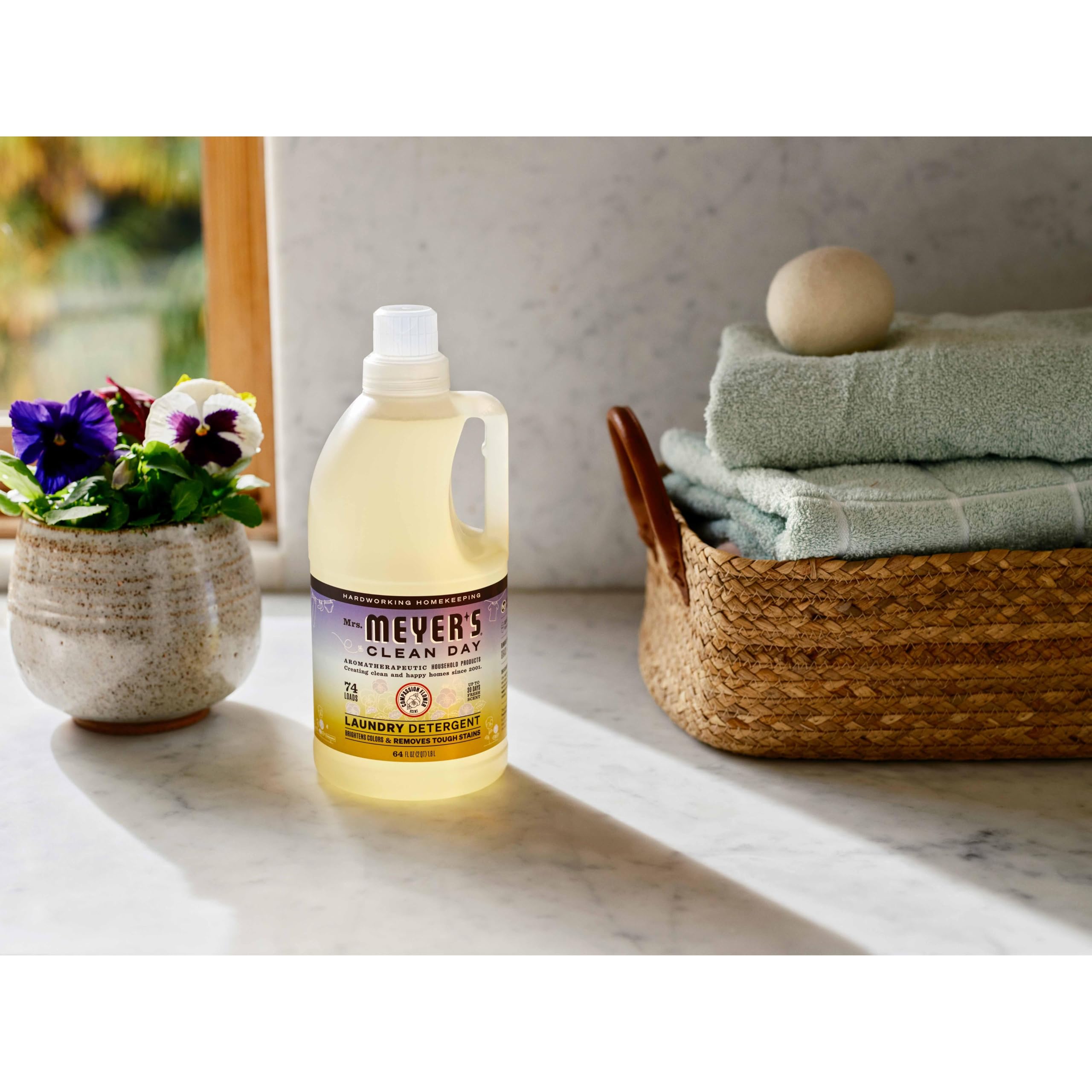 Showcase of other Mrs. Meyer's Clean Day products like hand soap and candles.