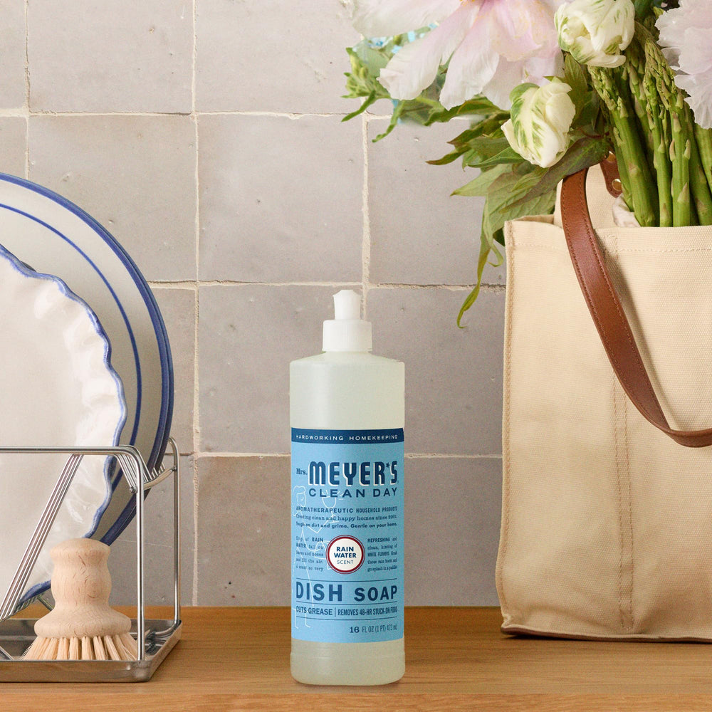Three-pack display of Mrs. Meyer's Rain Water dish soap communicates value.