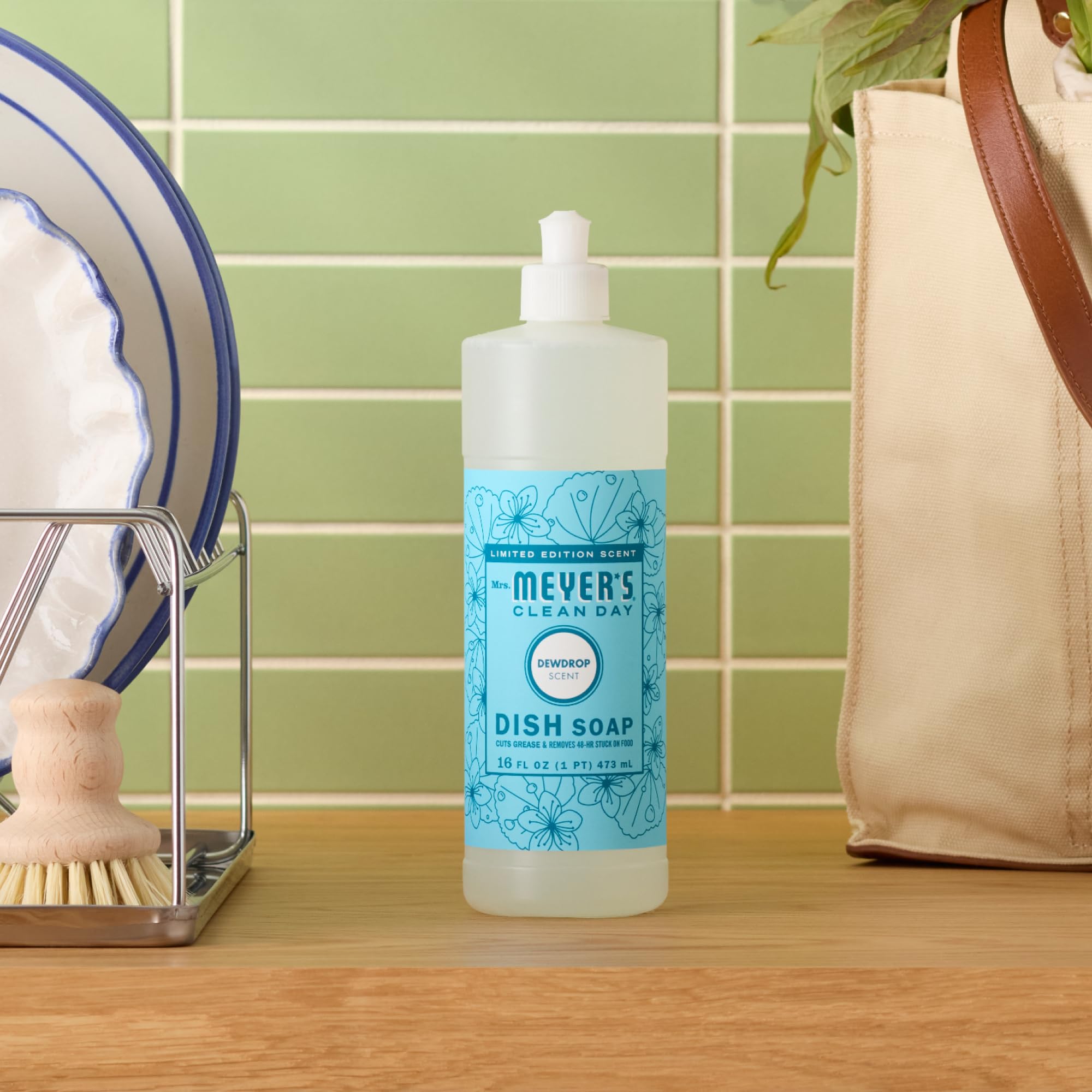 Mrs. Meyer's Dewdrop with hands shows gentle cleansing during washing.