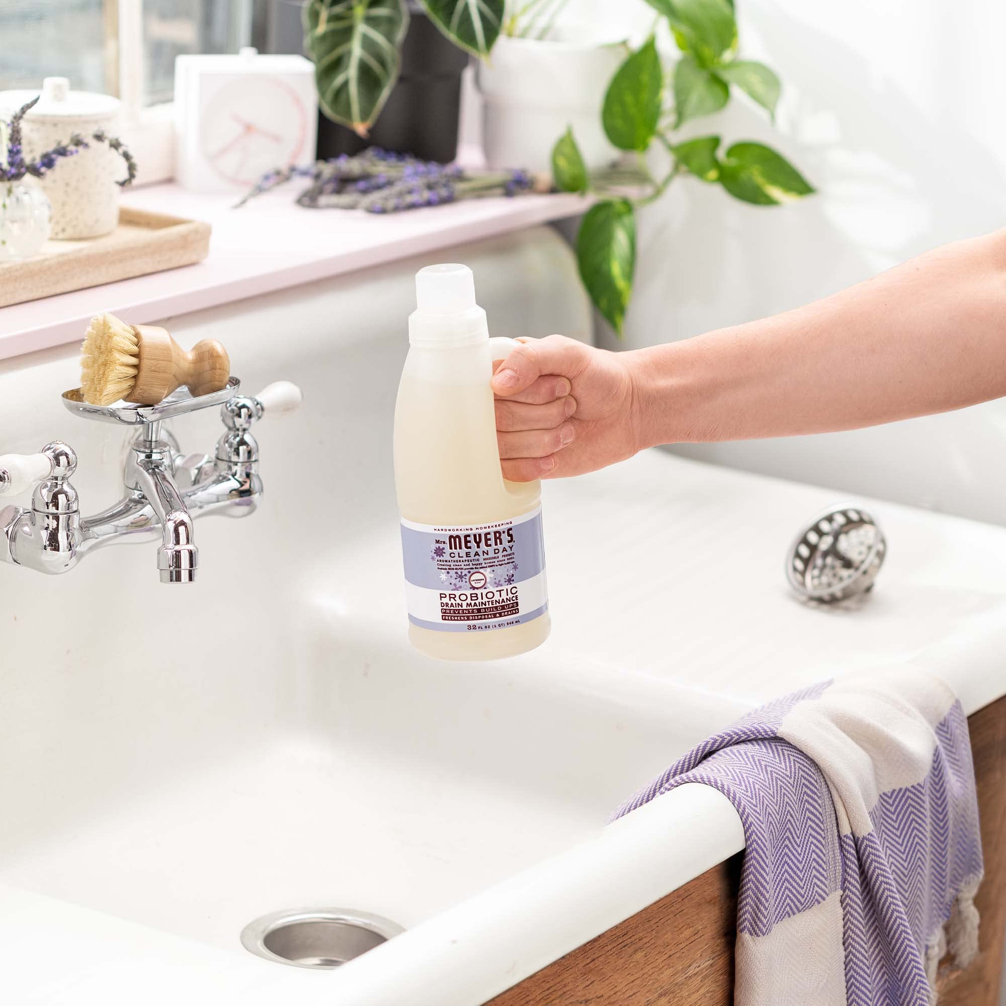 Mrs. Meyer's Probiotic Drain Maintenance Lavender eco bottle emphasizes sustainable packaging.