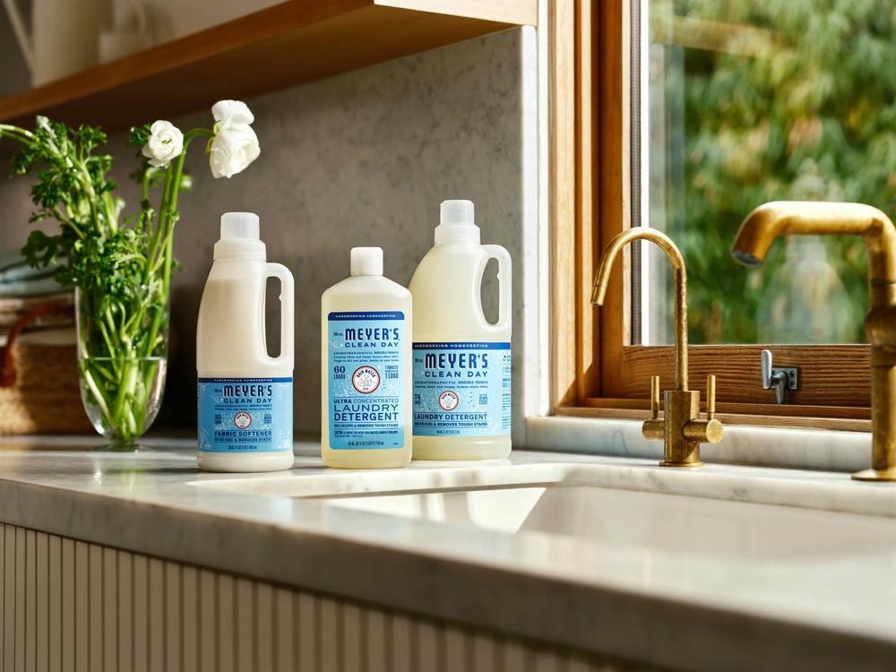 Laundry room scene with Mrs. Meyer's Rain Water detergent in use.