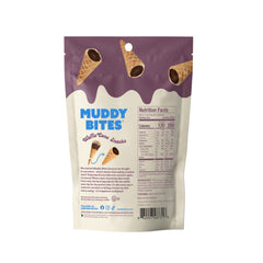 Muddy Bites filled cone bite closeup reveals creamy chocolate center.
