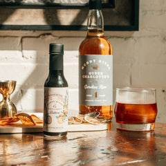 Muddy River Distillery Aromatic Bitters old-fashioned glass demonstrates smooth, balanced whiskey cocktails.