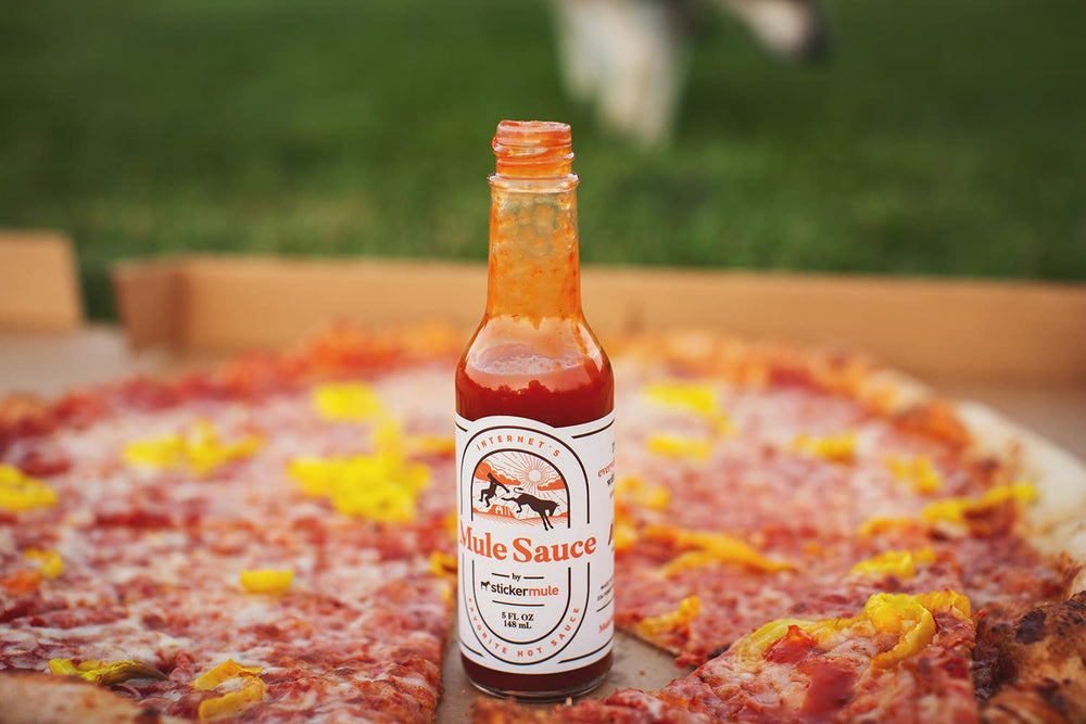 Sticker Mule Mule Sauce pouring action ready to spice up meals