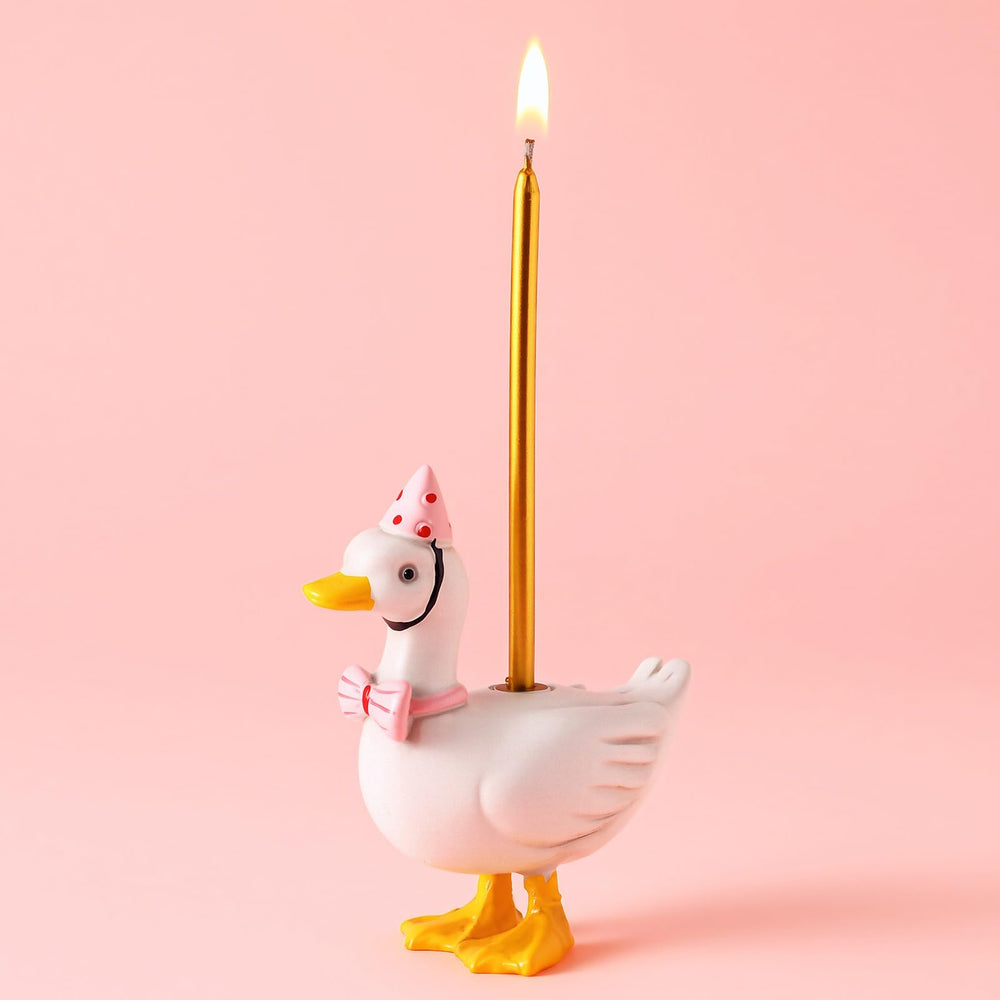 Mumufy silly goose cake candle holder in pink with bow and hat for celebrations.