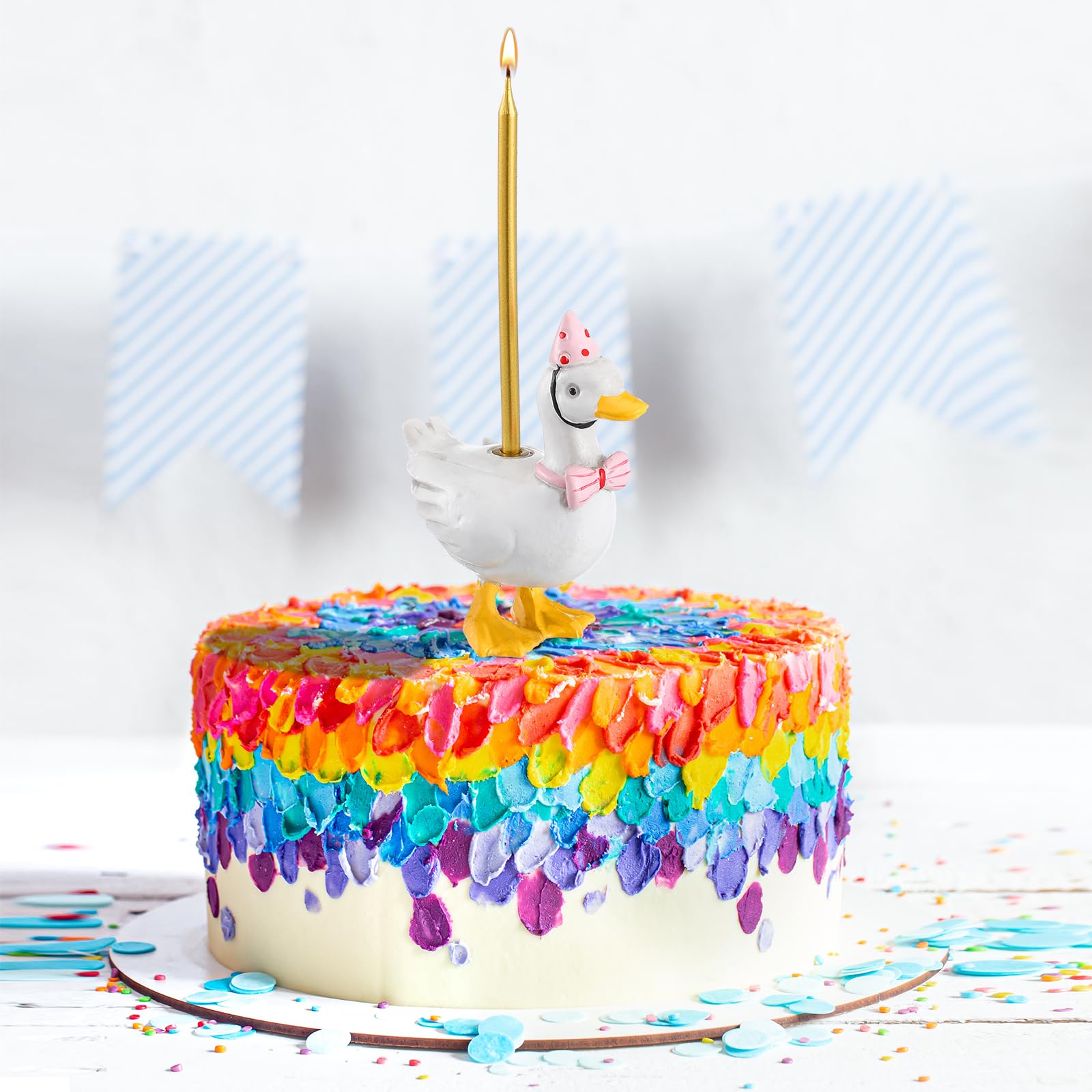 Mumufy goose topper beside cupcakes to inspire playful mood.