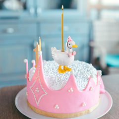 Mumufy silly goose cake topper on dessert display to spark whimsy.