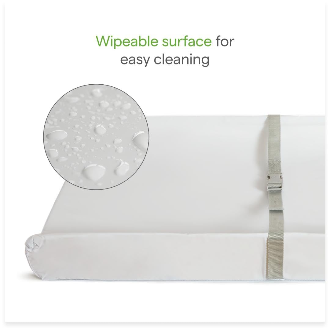 Munchkin Secure Grip contoured cushion supports baby during diaper changes.