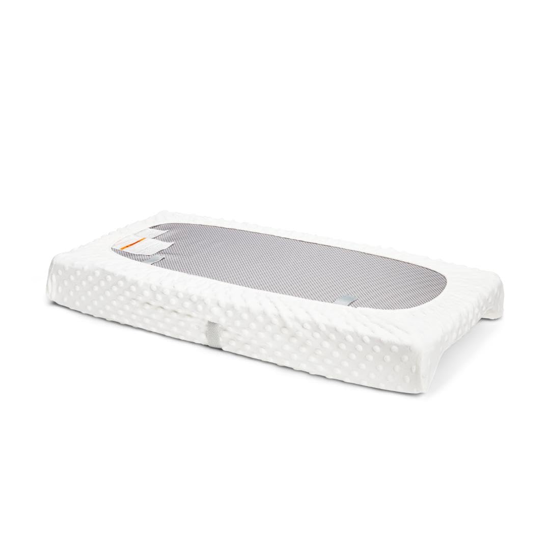 Munchkin Secure Grip pads with Xtra Grip strips prevent slipping during changes.