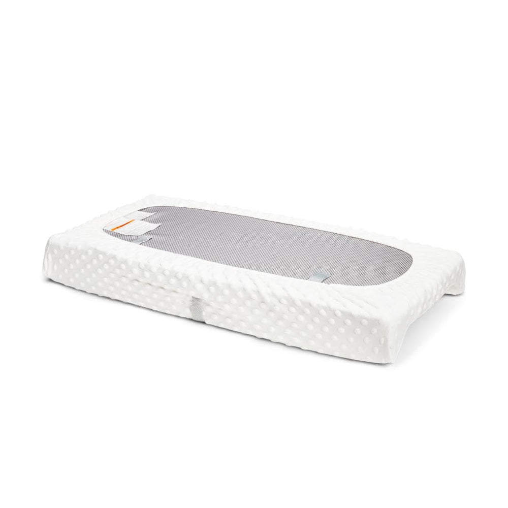 Munchkin Secure Grip pads with Xtra Grip strips prevent slipping during changes.