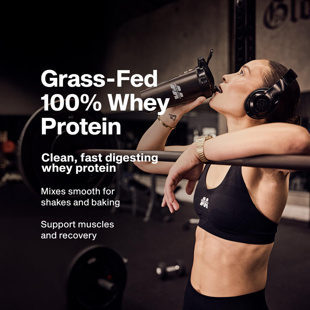 MuscleTech whey powder scoop ready to blend into a high-protein shake.