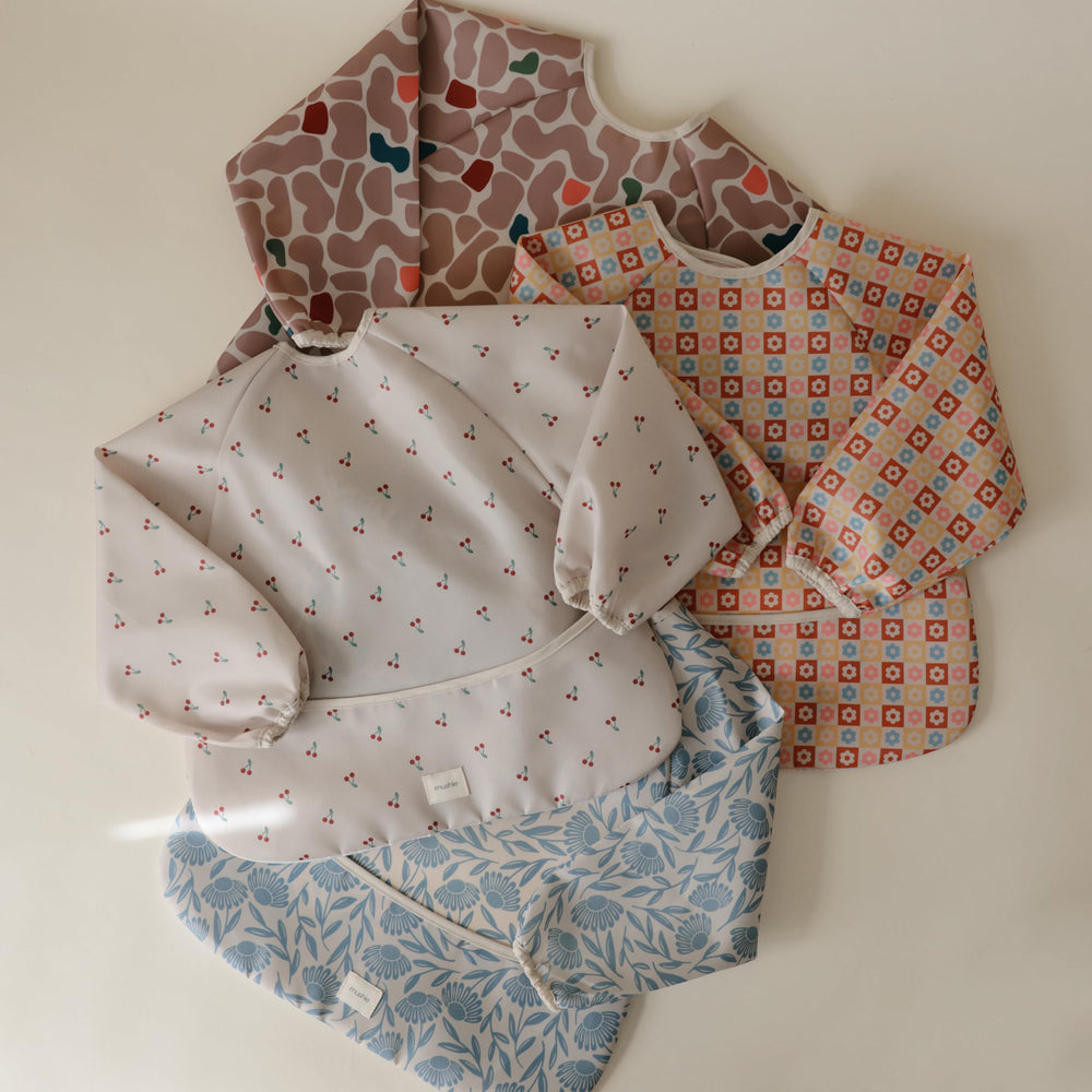 Mushie bib wipe-clean fabric makes mealtime tidy and quick to refresh