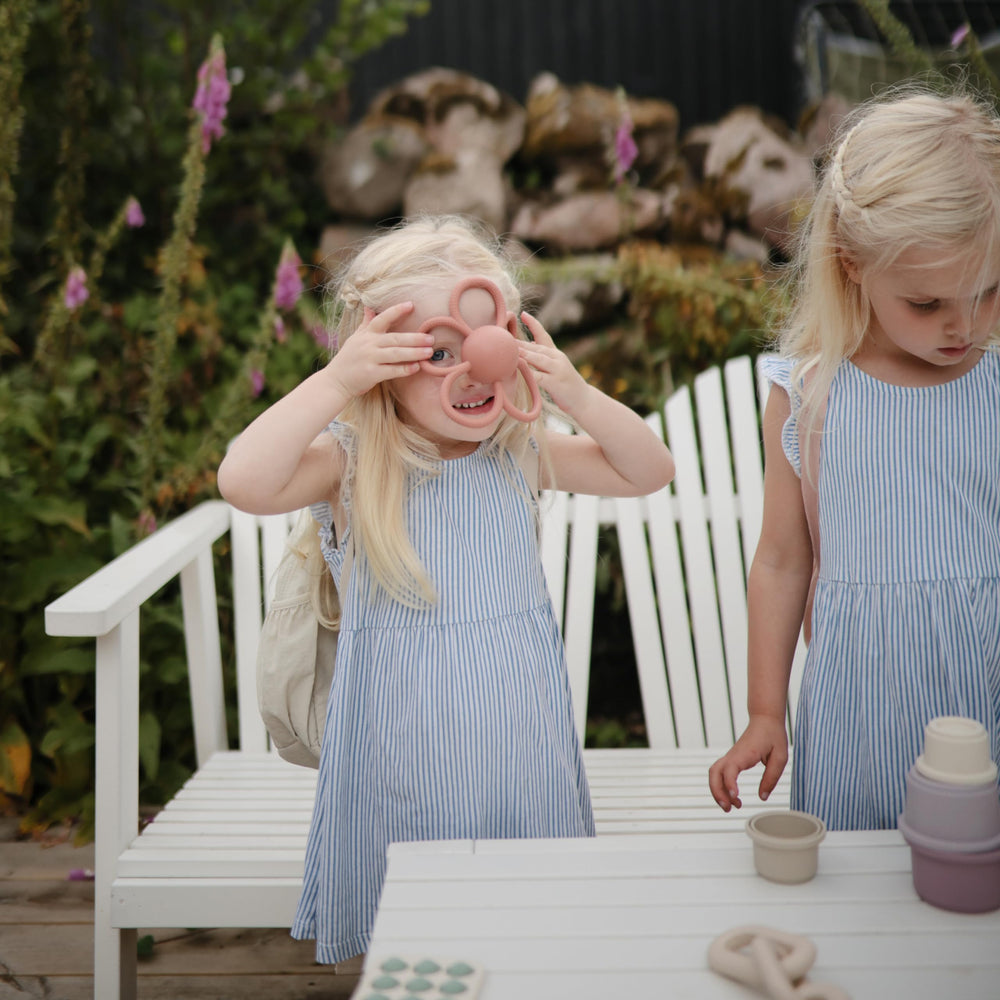 Built-in rattle adds auditory interest for babies during playtime.